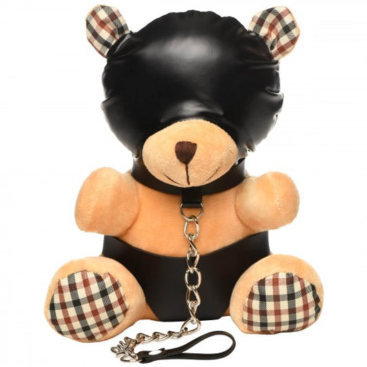 A small, adorable brown hooded bear with light peach fur, wearing vegan leather panties and a gimp mask, attached to a metal chain leash on its collar; perfect for gifting or cuddling, measuring 9 inches long by 6.5 inches wide by 5.3 inches deep.