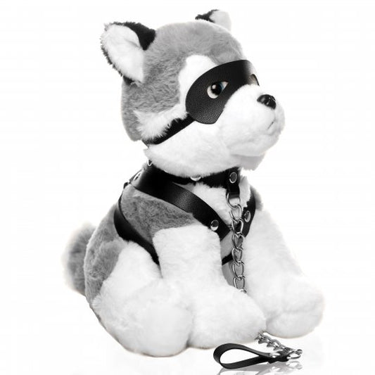 Gray, white, and black plush husky dog with a playful expression, wearing a vegan-leather harness, collar, and leash, posed against a neutral background.