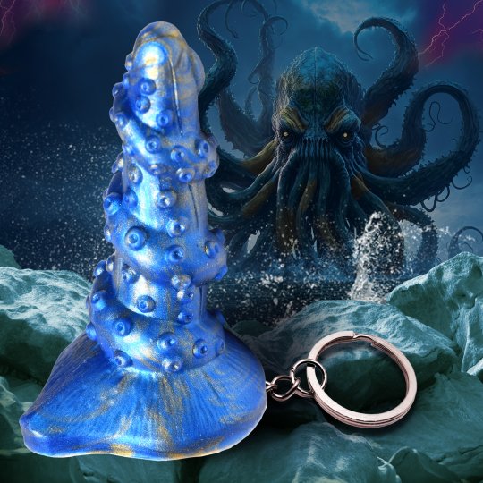 A vibrant blue and gold tentacle keychain made from premium silicone, designed with twisted ridges and suckers, showcasing a mini fantasy dong for novelty use, ideal for attaching to bags or keyrings.