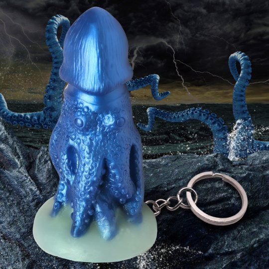 Miniature blue octopus-shaped keychain made of phthalate-free silicone, featuring a girthy design with vibrant color and exaggerated features, ideal for fantasy roleplay and novelty gifts.