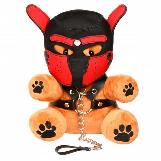 Cuddly plush bear with removable bondage gear including a hood, muzzle, harness, collar, and leash; brown with black and red accents, measuring 9 inches long, 7.3 inches wide, and 5.5 inches deep. Not intended for children.