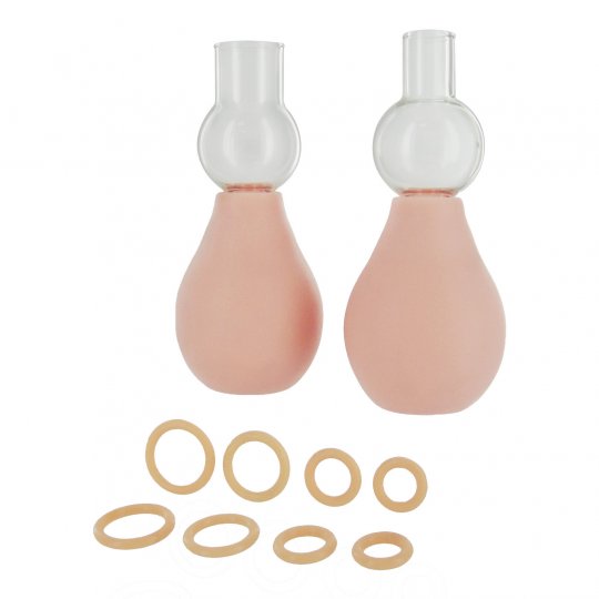 Image of The Perfect Fit Nipple Enlarger featuring two pumps and eight graduated O-rings in flesh color, showcasing their size range and rubber and glass materials.