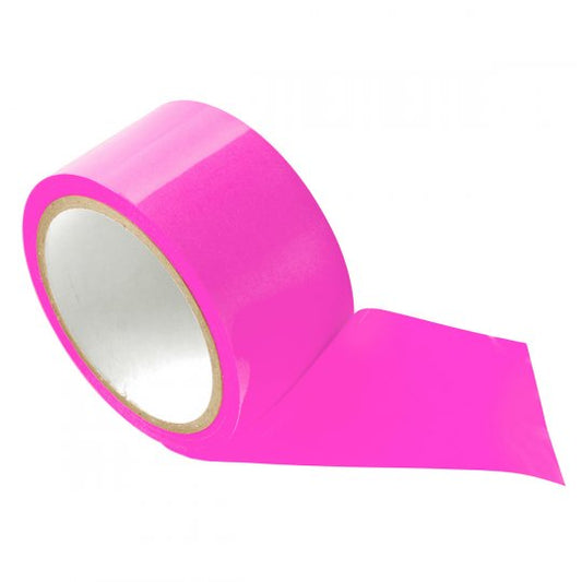 A roll of shiny pink PVC bondage tape, 65 feet long and 2 inches wide, displayed on a soft surface, showcasing its non-sticky properties ideal for binding, gagging, blindfolding, or dressing.