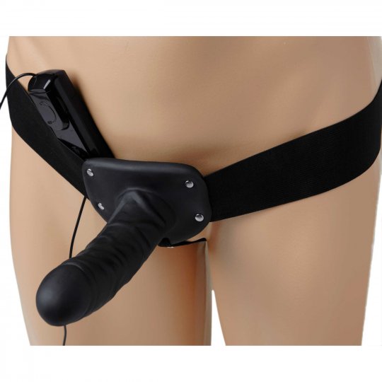 Deluxe Vibro Erection Assist strap-on penis with textured surface, adjustable elastic straps, and built-in variable speed bullet for added stimulation, displayed against a neutral background.