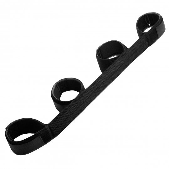 Ultra comfortable spreader bar restraint system featuring heavy duty nylon cuffs with neoprene lining, secured by Velcro closures. Cuffs are spaced 16 inches apart for ankles and 9 inches apart for wrists, mounted on a nylon-wrapped metal reinforced bar, measuring 22 inches in total length. Color: Black.