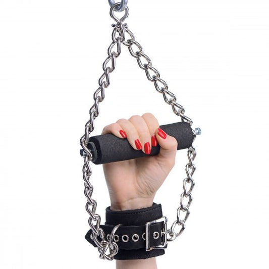 Heavy duty suspension cuffs made of Nubuck leather with faux fur lining, featuring a built-in wooden handle wrapped in foam, adjustable from 7 to 12 inches in circumference, showcasing a black color, displayed alongside a weight-bearing chain.