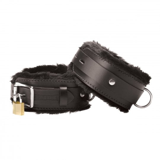 Black leather fur lined cuffs with adjustable sizing slots, featuring a 2 inch wide strap and a 1 inch wide lockable top strap, showcasing comfort and durability.